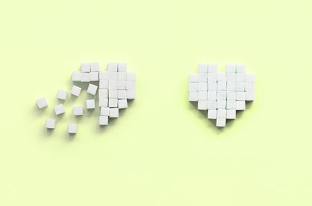 A few hearts made of sugar cubes lies on a trendy pastel lime background.の写真素材