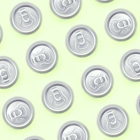 Many metallic beer cans on texture background of fashion pastel lime color paper in minimal concept.の写真素材