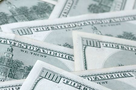 Background of 100 dollar bills. Abstract textured backdrop with many hundred money bills. Rich life...