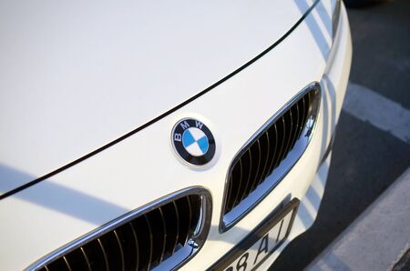 KHARKOV, UKRAINE - SEPTEMBER 24, 2019: Front view of white BMW car with company logo