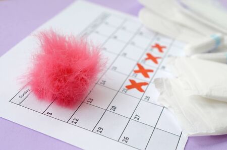Aspects of women wellness in monthlies period. Menstrual pads and tampons on menstruation period...
