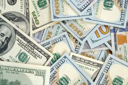 Top view of one hundred dollar banknotes made background. USD currency concept and rich life....