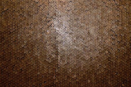Pattern of 12 gauge cartridges for shotgun bullets. Shells for hunting rifle close up. Backdrop for...