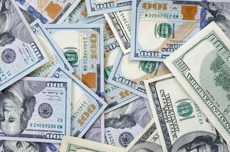 Top view of one hundred dollar banknotes made background. USD currency concept and rich life....