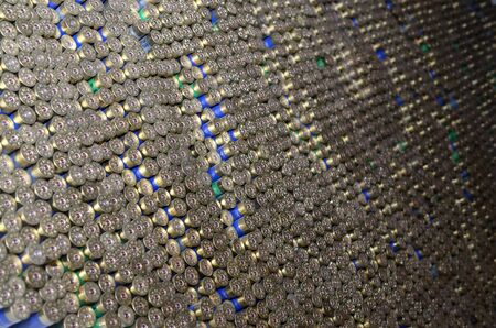 Pattern of 12 gauge cartridges for shotgun bullets. Shells for hunting rifle close up. Backdrop for...