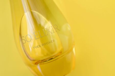 KHARKOV, UKRAINE - OCTOBER 21, 2019: Bottle of So Elixir perfume by Yves Rocher on bright yellow...