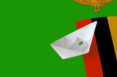 Zambia flag depicted on paper origami ship closeup. Oriental handmade arts conceptの写真素材