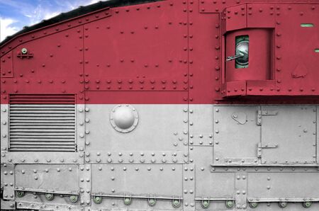 Monaco flag depicted on side part of military armored tank close up. Army forces conceptual...