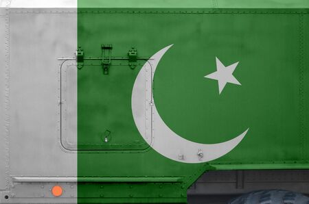 Pakistan flag depicted on side part of military armored truck close up. Army forces vehicle conceptual backgroundの写真素材