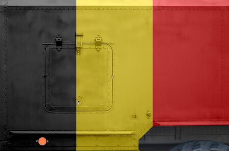 Belgium flag depicted on side part of military armored truck close up. Army forces vehicle conceptual backgroundの写真素材