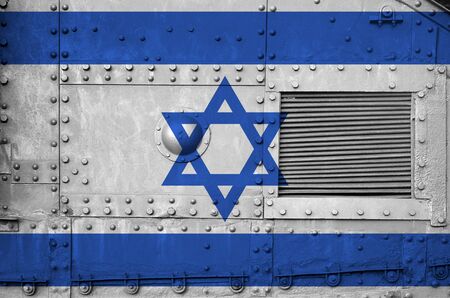 Israel flag depicted on side part of military armored tank close up. Army forces conceptual backgroundの写真素材