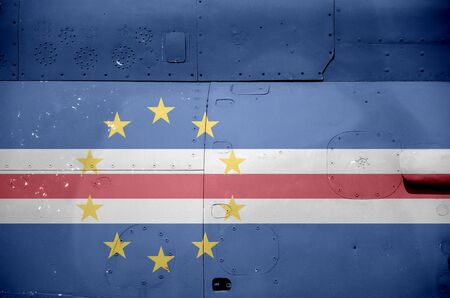 Cabo verde flag depicted on side part of military armored helicopter close up. Army forces aircraft conceptual backgroundの写真素材