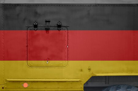 Germany flag depicted on side part of military armored truck close up. Army forces vehicle conceptual backgroundの写真素材