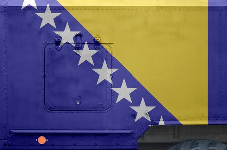 Bosnia and Herzegovina flag depicted on side part of military armored truck close up. Army forces...