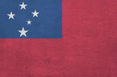 Samoa flag depicted in bright paint colors on old relief plastering wall close up. Textured banner on rough backgroundの写真素材
