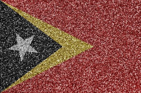 Timor Leste flag depicted on many small shiny sequins. Colorful festival background for disco partyの写真素材