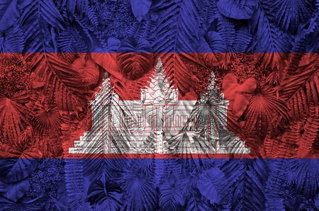Cambodia flag depicted on many leafs of monstera palm trees. Trendy fashionable backgroundの写真素材
