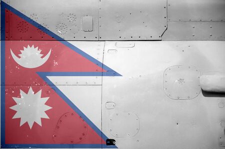 Nepal flag depicted on side part of military armored helicopter close up. Army forces aircraft conceptual backgroundの写真素材