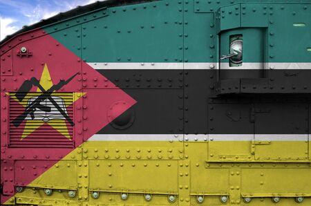 Mozambique flag depicted on side part of military armored tank close up. Army forces conceptual backgroundの写真素材