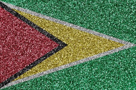 Guyana flag depicted on many small shiny sequins. Colorful festival background for disco partyの写真素材