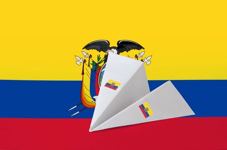 Ecuador flag depicted on paper origami airplane. Oriental handmade arts conceptの写真素材