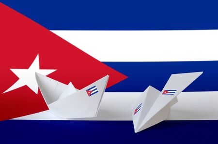 Cuba flag depicted on paper origami airplane and boat. Oriental handmade arts conceptの写真素材