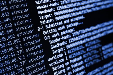 Macro snapshot of the program interface for crypto currency mining on the monitor of an office...