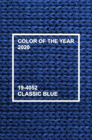 The texture of a knitted sweater wallpaper. Woolen fabric for wallpaper and an abstract background. Phantom classic blue color toneの写真素材