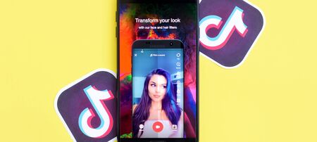 NY, USA - DECEMBER 5, 2019: Tiktok application on samsung smartphone screen on yellow background....