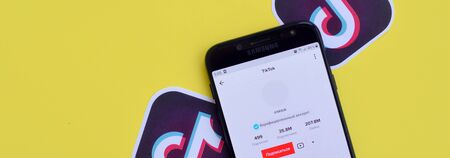 NY, USA - DECEMBER 5, 2019: Tiktok application on samsung smartphone screen on yellow background. TikTok is a popular video-sharing social networking service owned by ByteDanceのeditorial素材