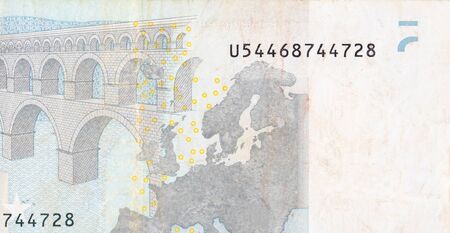 Fragment part of 5 euro banknote close-up with small brown details. European currency billの写真素材