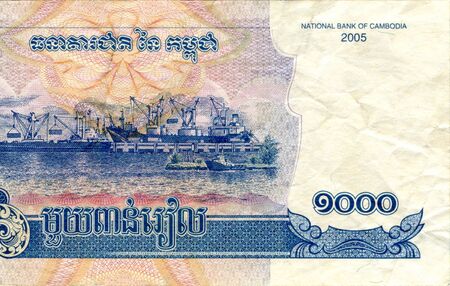 Fragment of 1000 Cambodian riels banknote is national currency of Cambodia. Side of money bill close...