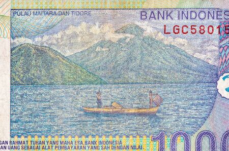 Pulau Maitara Dan Tidore on Indonesia 1000 rupiah bank note, former currency of Indonesia. Colored bill close up fragmentの写真素材