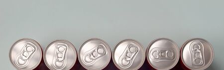 Many new aluminium cans of soda soft drink, lemonade cola, beer or energy drink containers. Drinks...