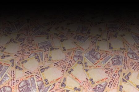 Mahatma Gandhi face on Indian bank note ten rupees. 10 Rupee National currency of India INR. Orange...