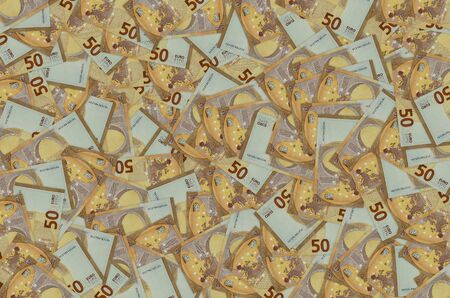 Pattern part of 50 euro banknote close-up with small brown details. European currency bill