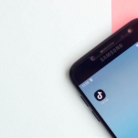 KHARKOV, UKRAINE - FEBRUARY 16, 2020: Tiktok application on samsung smartphone screen on pastel...