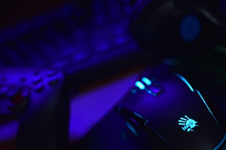 KHARKOV, UKRAINE - JANUARY 19, 2020: Gamesir g3s video game controller and Bloody p93 gaming mouse on office table with a4tech keyboard and headphonesのeditorial素材