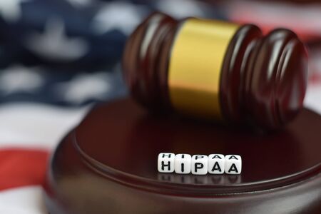 Justice mallet and HIPAA acronym close up. Health insurance portability and accountability actの写真素材