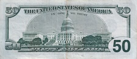 US Capitol on 50 dollars banknote back side closeup macro fragment. United states fifty dollars...