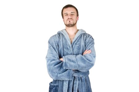 Portrait of young caucasian bearded proud man in blue bathrobe with crossed hands isolated on white background. Confident emotion conceptの写真素材