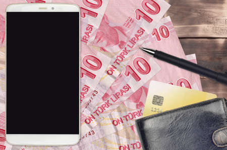 10 Turkish liras bills and smartphone with purse and credit card. E-payments or e-commerce concept....
