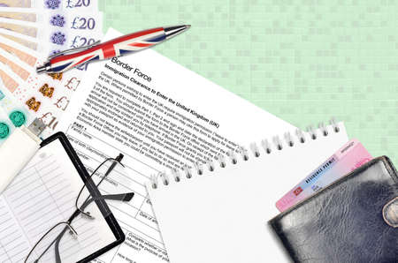 English form Immigration clearance to enter the UK from Border force services lies on table with...