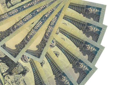 50 Nepalese rupees bills lies isolated on white background with copy space stacked in fan shape...