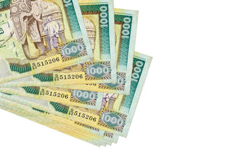 1000 Sri Lankan rupees bills lies in small bunch or pack isolated on white. Mockup with copy space....