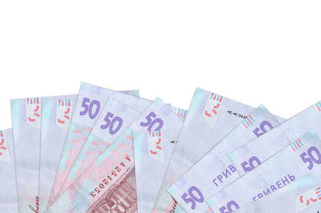 50 Ukrainian hryvnias bills lies on bottom side of screen isolated on white background with copy...