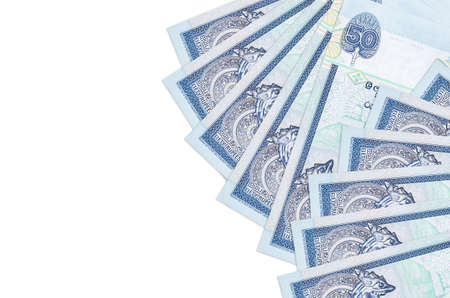 50 Sri Lankan rupees bills lies isolated on white background with copy space. Rich life conceptual background. Big amount of national currency wealthの写真素材