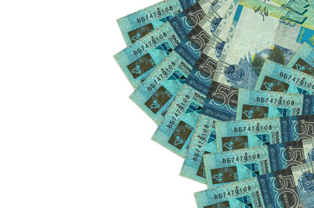 500 Kazakhstani tenge bills lies isolated on white background with copy space. Rich life conceptual...