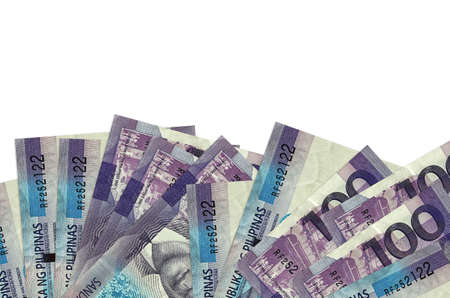 100 Philippine piso bills lies on bottom side of screen isolated on white background with copy...