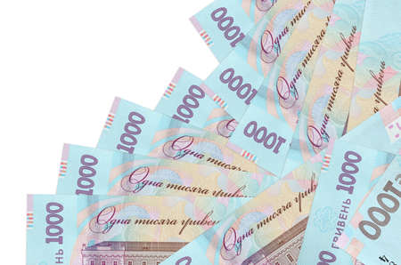 1000 Ukrainian hryvnias bills lies in different order isolated on white. Local banking or money making concept. Business background bannerの写真素材